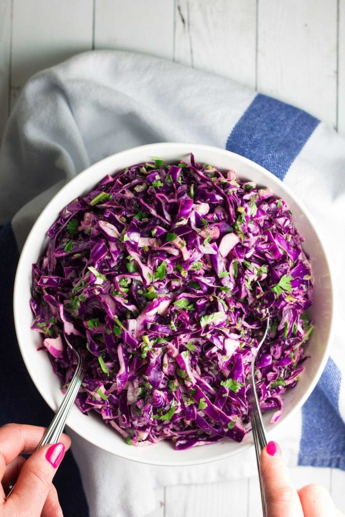 Flavorful and easy to make! This 10-minute healthy coleslaw recipe is perfect for tacos, pulled pork sandwiches, on top of a big salad, or as a side dish with any meal! This paleo coleslaw recipe is also gluten free, dairy free, Whole30 approved, low carb, and keto! 