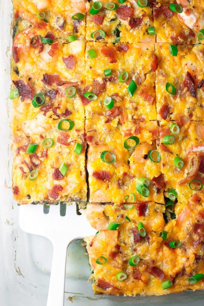 Low Carb Shrimp Bacon & Spinach Breakfast Casserole - This low carb breakfast casserole is the perfect intersection of healthy, comfort food, and just a little fancy with the addition of shrimp. This keto casserole is also gluten free and can be made paleo, dairy free, and Whole30! Whole30 breakfast casserole?? Oh yes! #shrimprecipe #whole30shrimp #ketobreakfast 