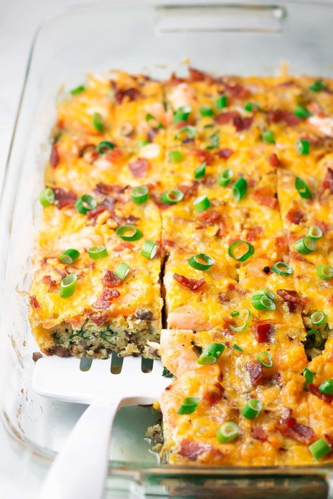 Low Carb Shrimp Bacon & Spinach Breakfast Casserole - This low carb breakfast casserole is the perfect intersection of healthy, comfort food, and just a little fancy with the addition of shrimp. This keto casserole is also gluten free and can be made paleo, dairy free, and Whole30! Whole30 breakfast casserole?? Oh yes! #shrimprecipe #whole30shrimp #ketobreakfast 