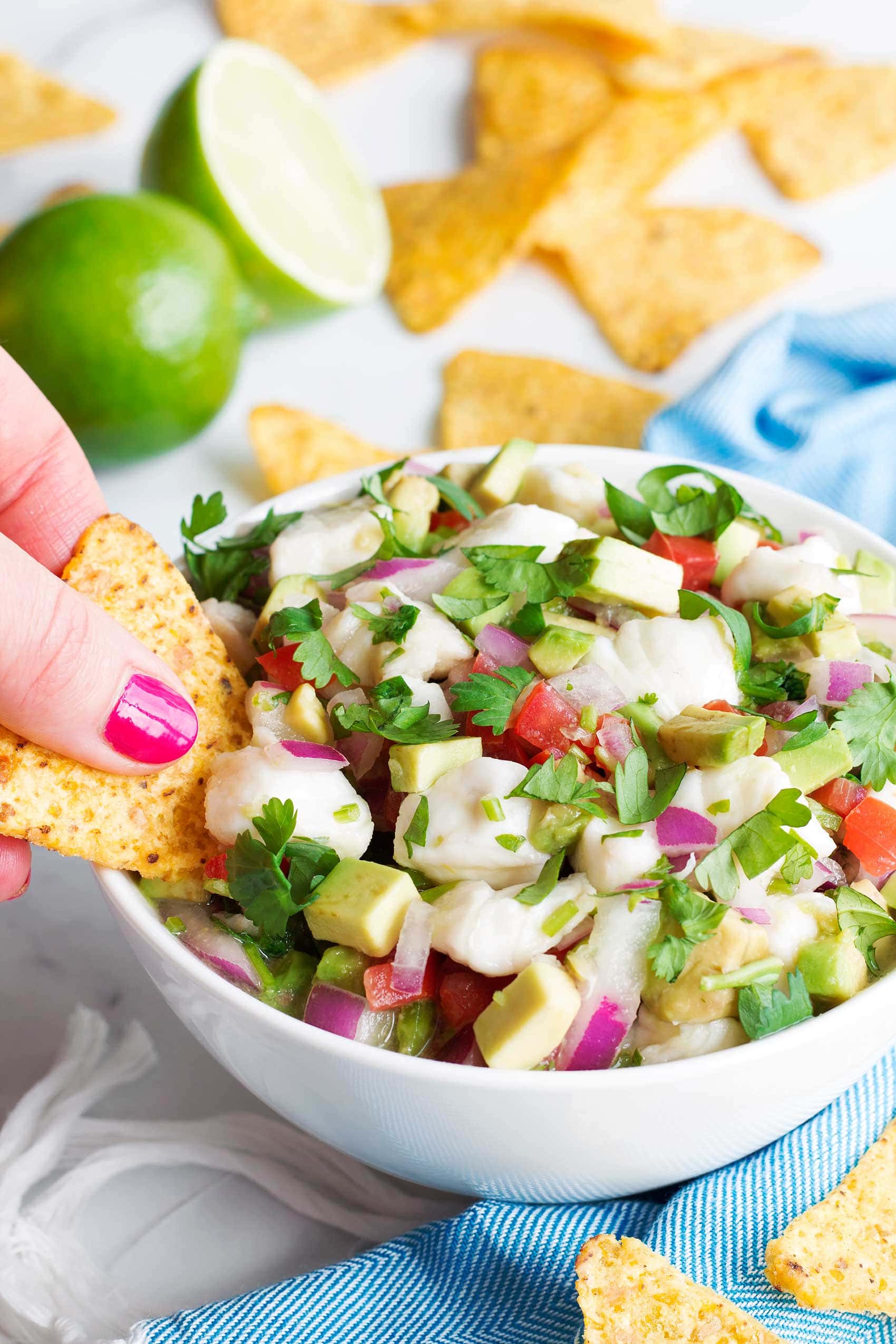 how to make ceviche, tortilla chip dipping into bowl of fresh ceviche