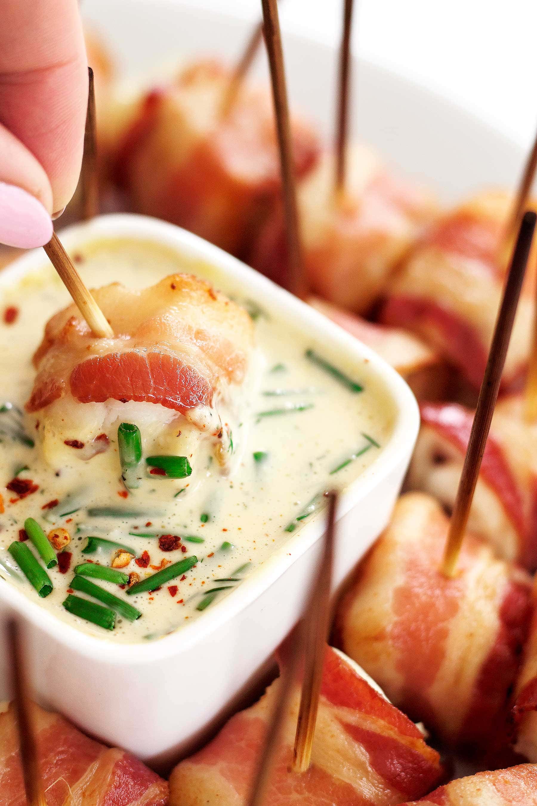 Delicious and party-ready in 25 mins! Game day reimagined. These bacon-wrapped grouper bites are just what you need to make your next party or game day feel special and taste amazing! This simple appetizer is #Whole30, #paleo, #glutenfree, #dairyfree, #lowcarb, #keto, and so easy to make!! It works with almost any fish or even shrimp or chicken! #paleoappetizer #whole30appetizer #gamedayrecipes #whole30recipes #healthyeating #bacon #grouper #glutenfreeappetizer #Whole30gameday #paleogameday #healthypartyfood #spicyranch #paleoranch #whole30ranch