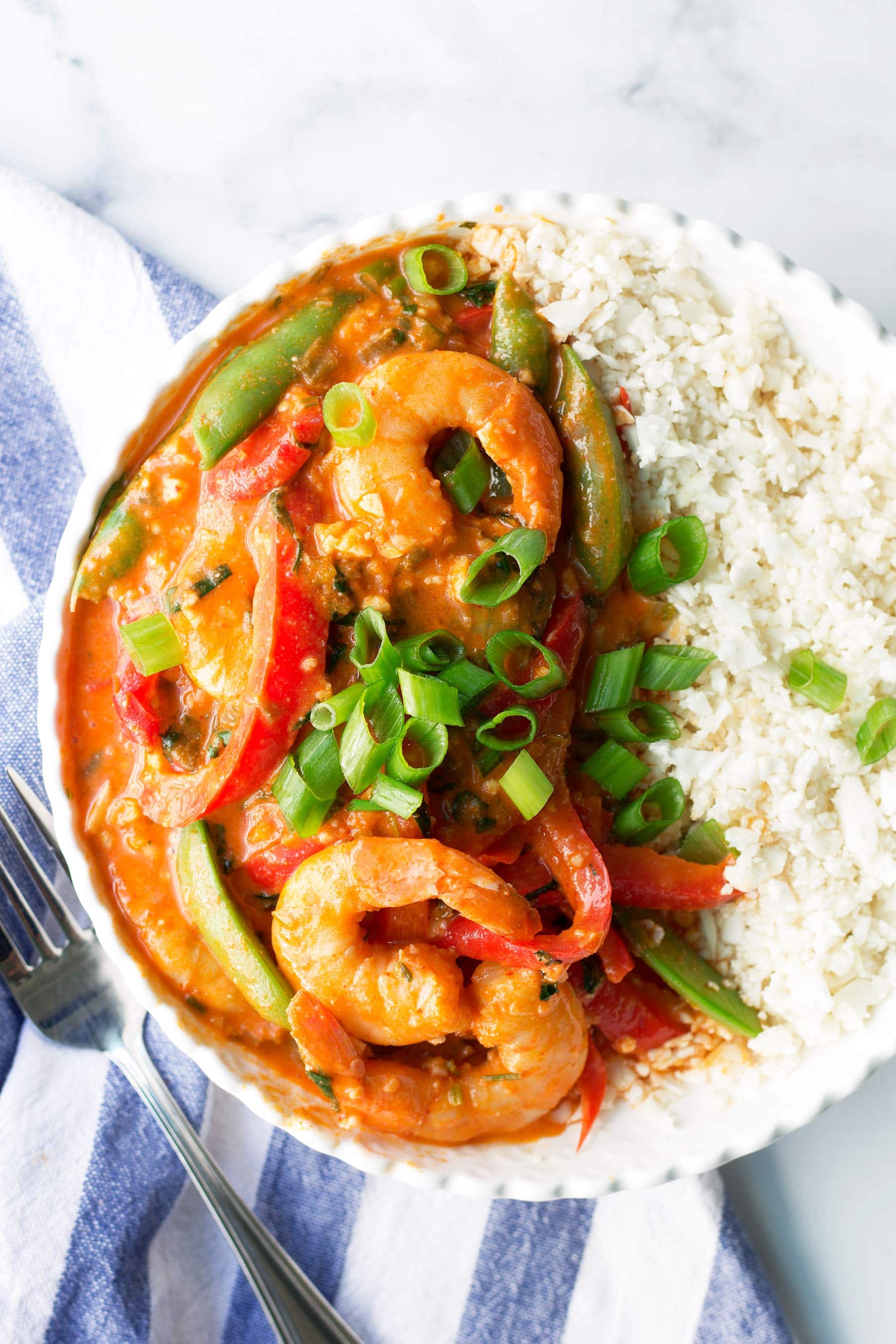 Just like takeout but healthier and made at home in 30 minutes! This easy keto dinner recipe is paleo, Whole30, low carb, gluten free, and dairy free! Perfect for a quick healthy weeknight meal! #paleodinner #whole30dinner #ketodinner #shrimp #shrimprecipe #shrimpdinner #thaicurry #healthyeating #healthydinner #mealprep #mealprepideas #whole30recipes #lowcarb #paleorecipes #glutenfreedinner #whole30lunch #ketolunch #paleo #coconutmilk #thaieggplant