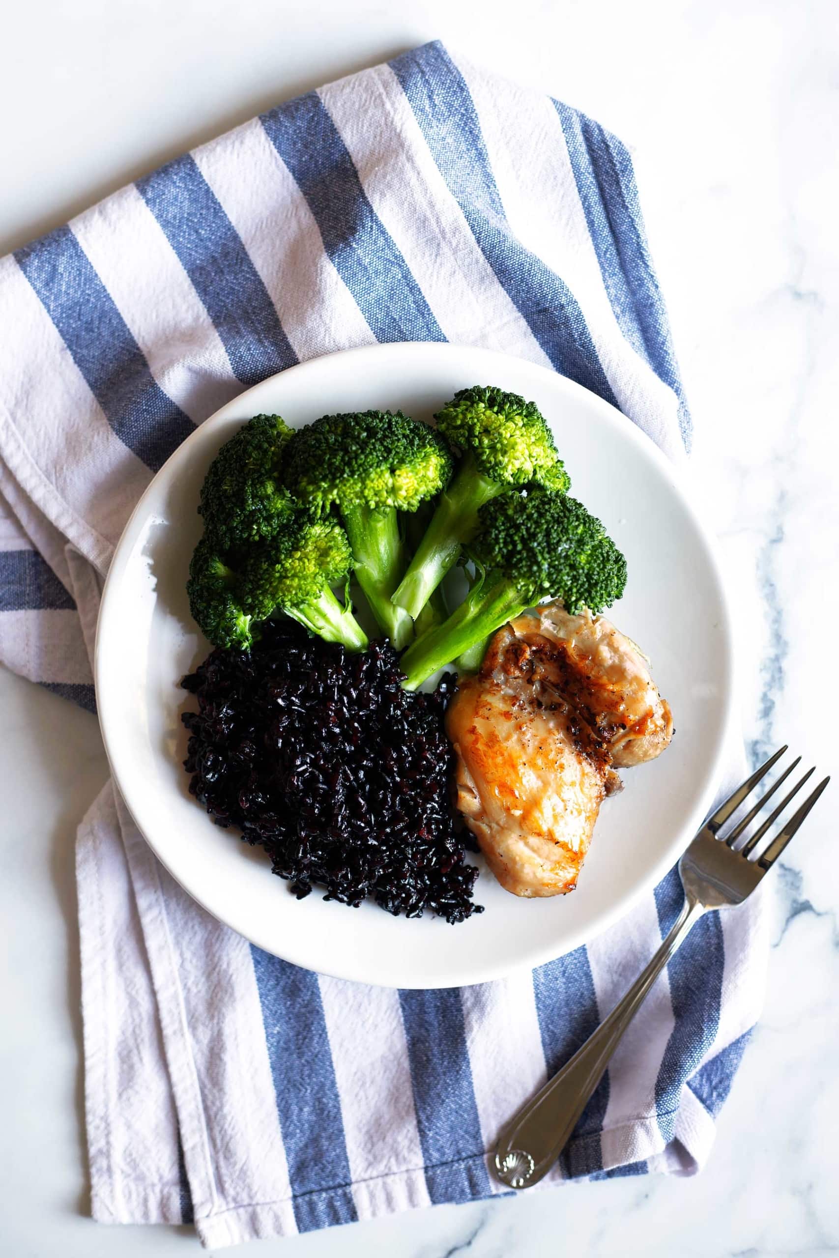 Just 3 ingredients and 3 minutes to prep! This easy Instant Pot recipe is perfect for a quick weeknight meal! The chicken thighs, black rice, and broccoli all cook at the same time in the Instant Pot. This recipe is Whole30, paleo, gluten free, and dairy free. #healthydinner #healthylunch #instantpotdinner #instantpot #chickenthighs #blackrice #paleodinner #whole30dinner #shrimp #chickenrecipe #healthyeating #mealprep #mealprepideas #whole30recipes #paleorecipes #glutenfreedinner #whole30lunch #paleo 