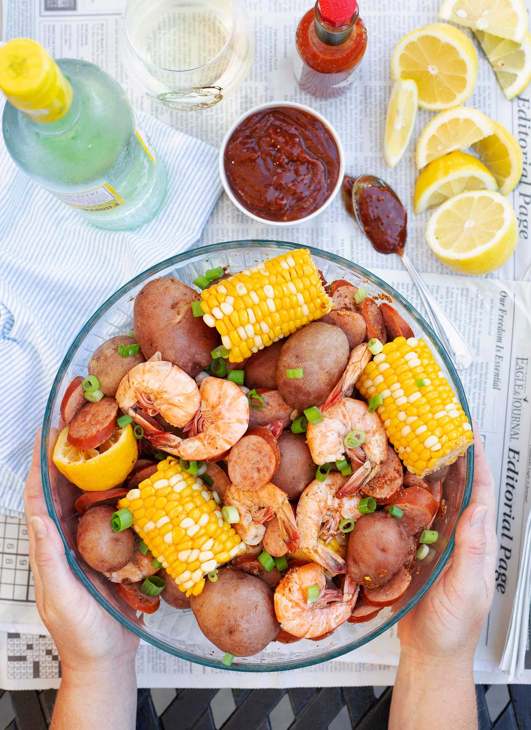 Shrimp Boil and Cocktail Sauce with corn on a bowl