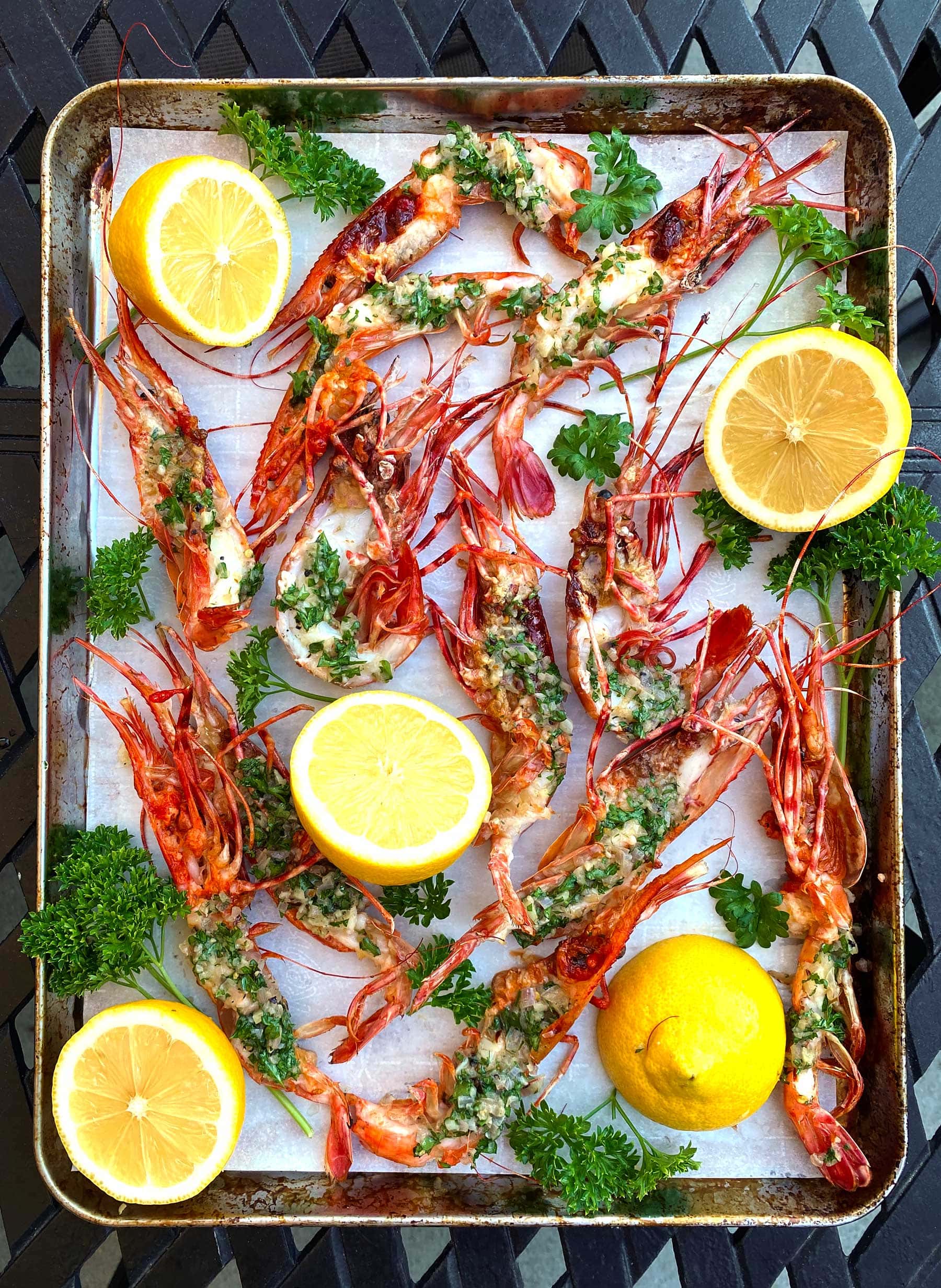 Grilled Spot Prawns with Garlic Herb Butter on a baking pan