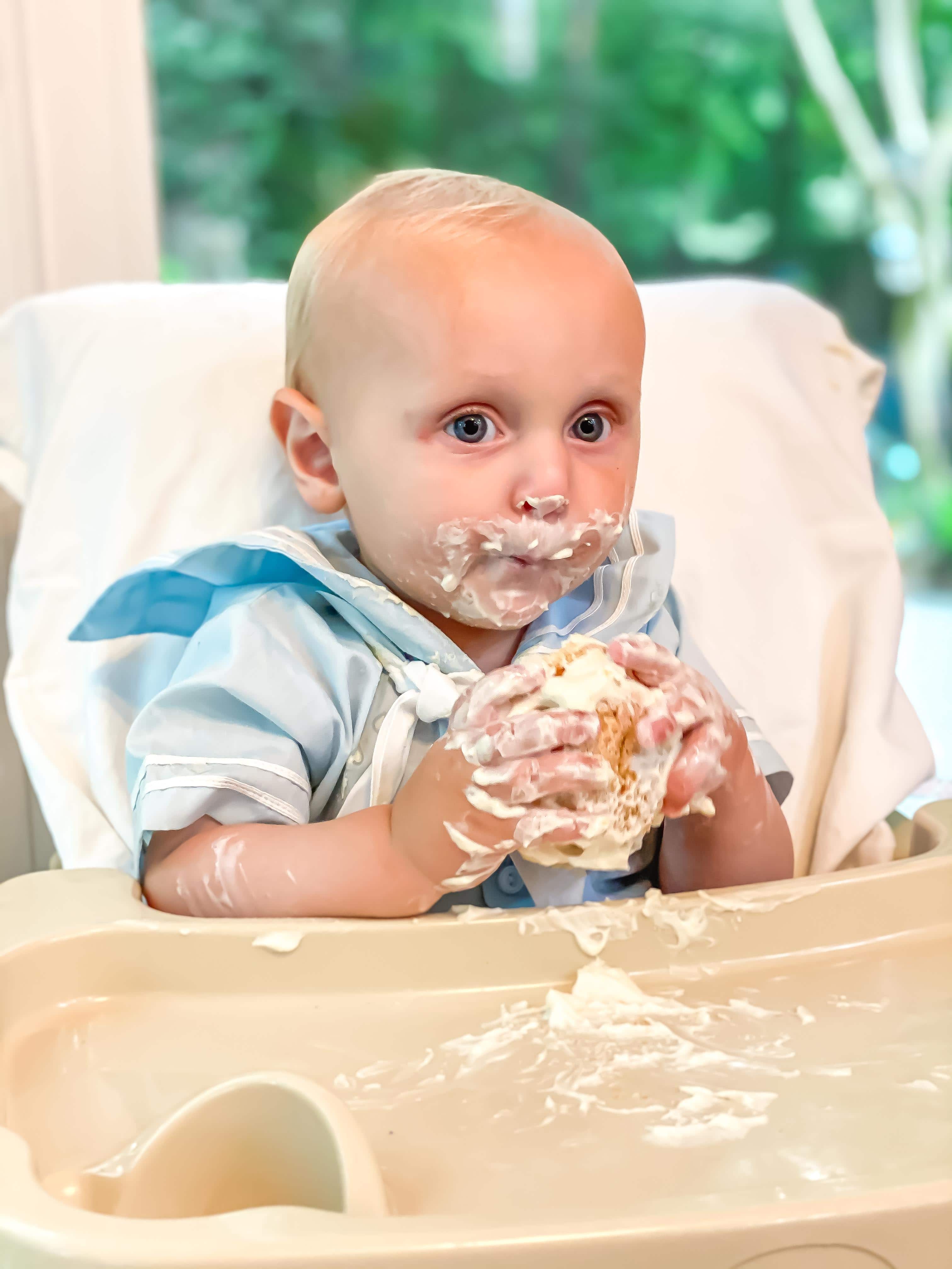 baby eating cake