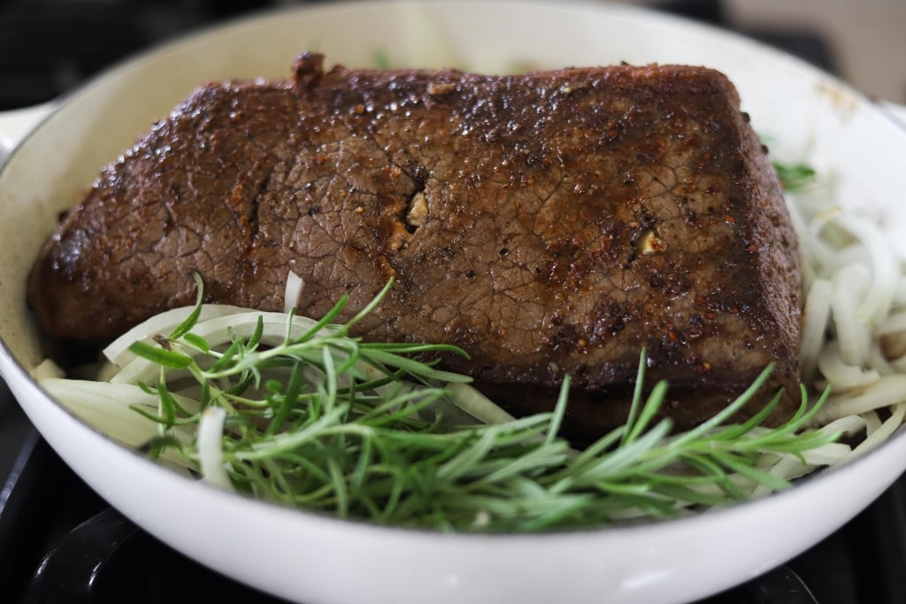 roast beef in braising pan after searing before roasting, how to cook melt in the mouth roast beef