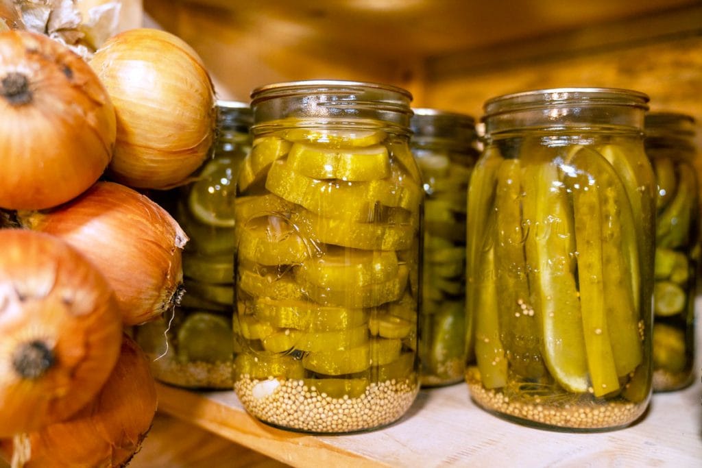pickles in jars on shelf