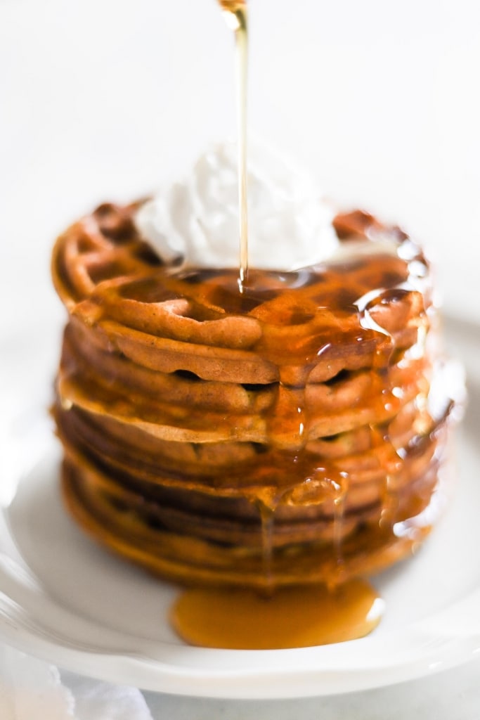 Gluten Free Pumpkin Waffle Recipe with syrup being poured on