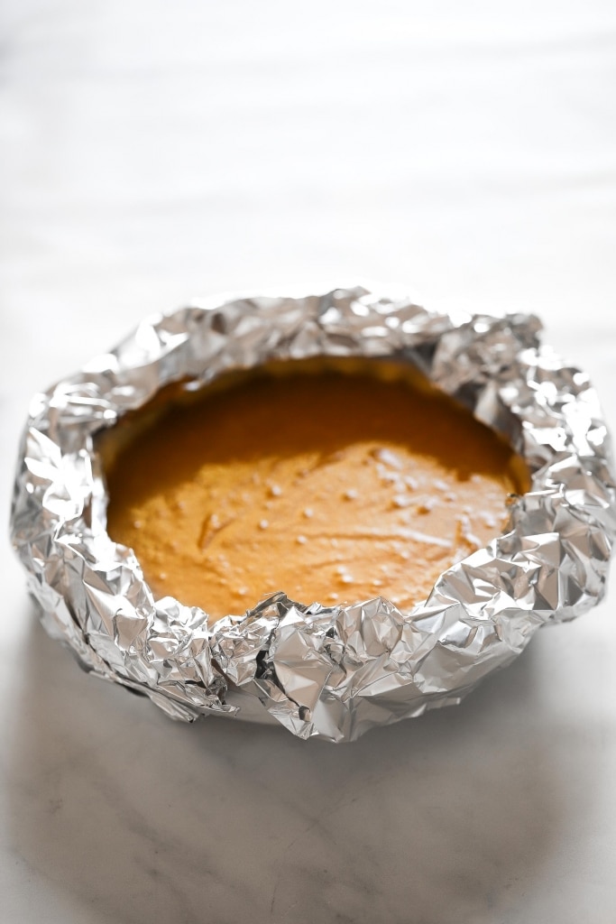 pumpkin pie with foil around rim