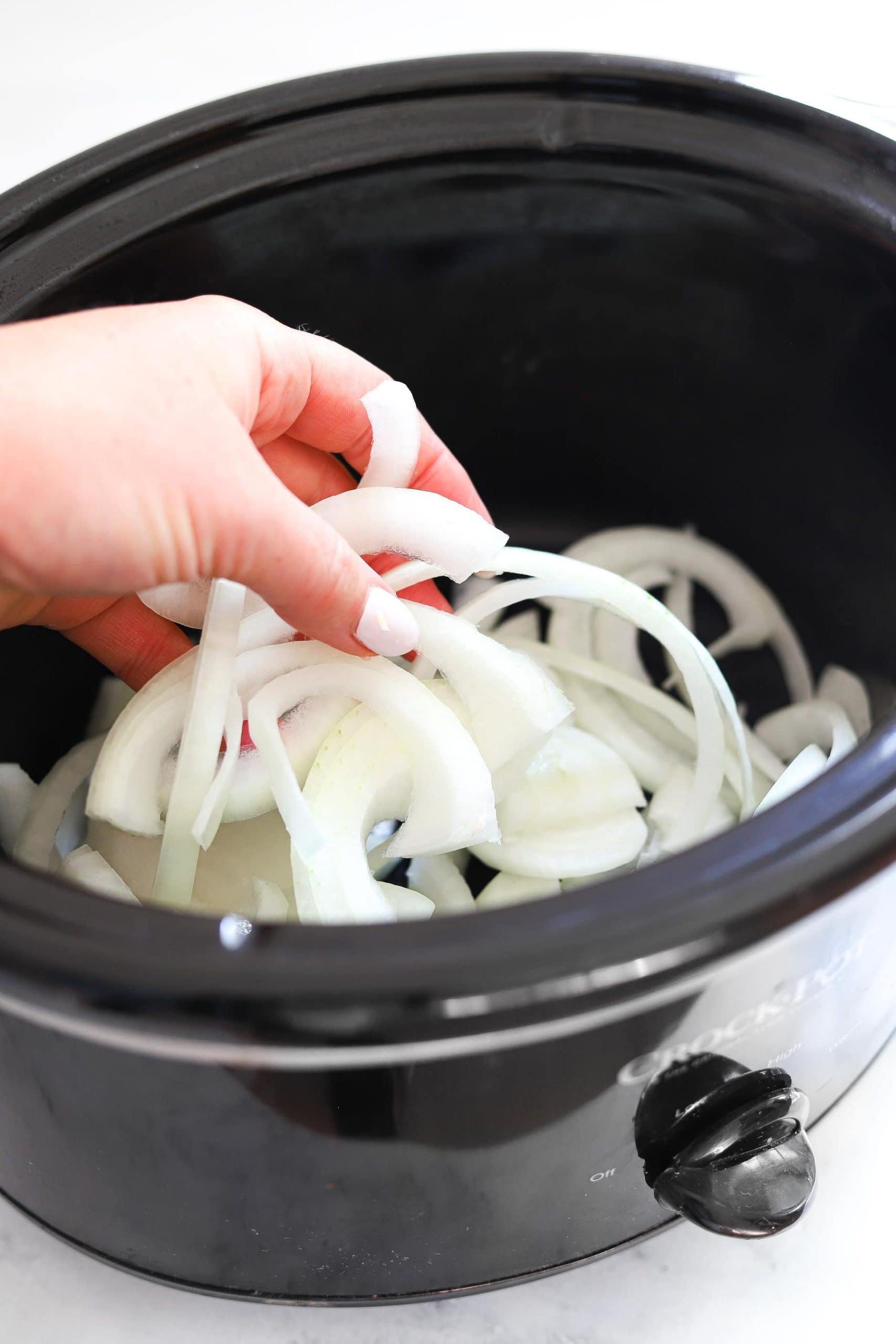 placing onions in crock pot