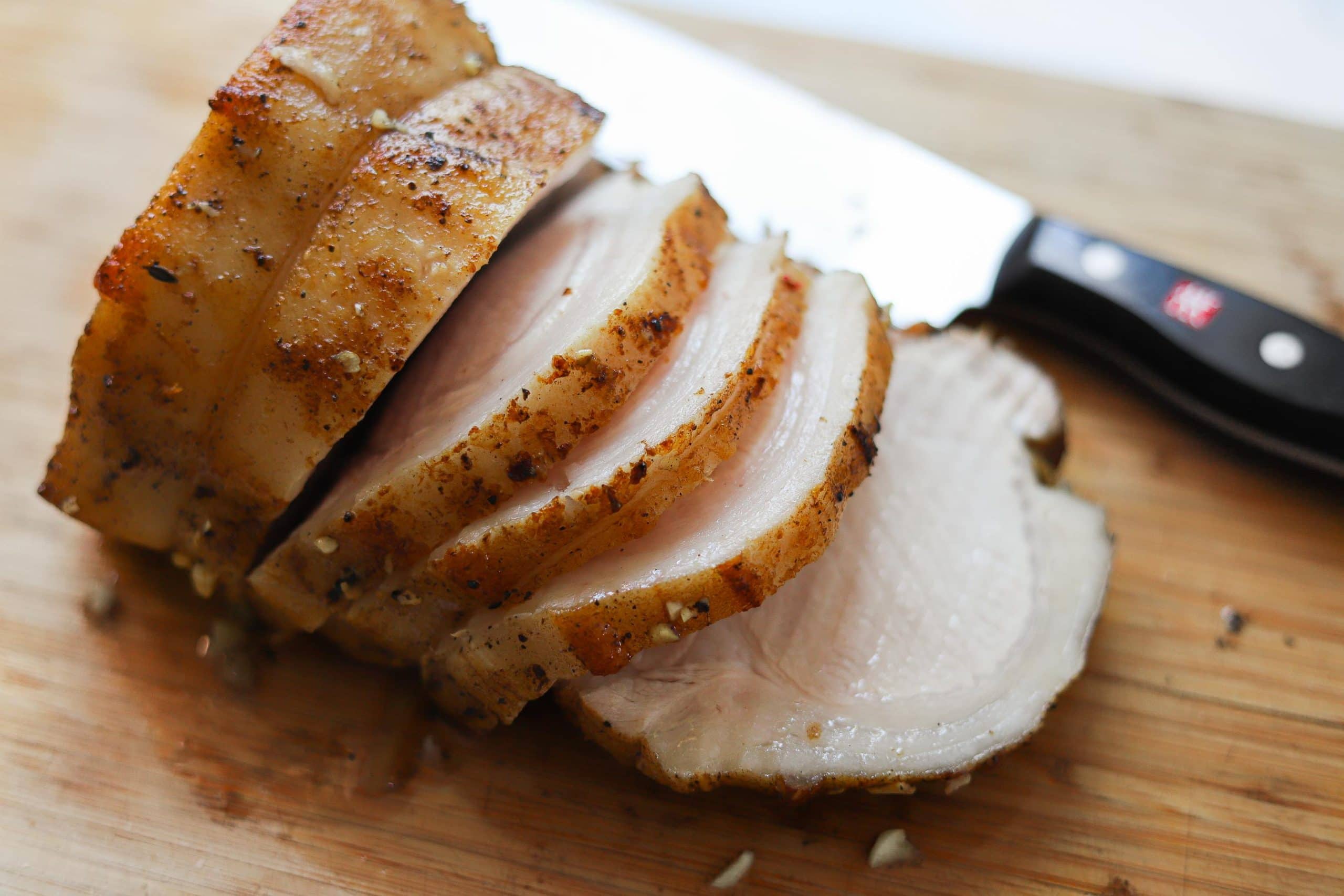 sliced pork loin on cutting board