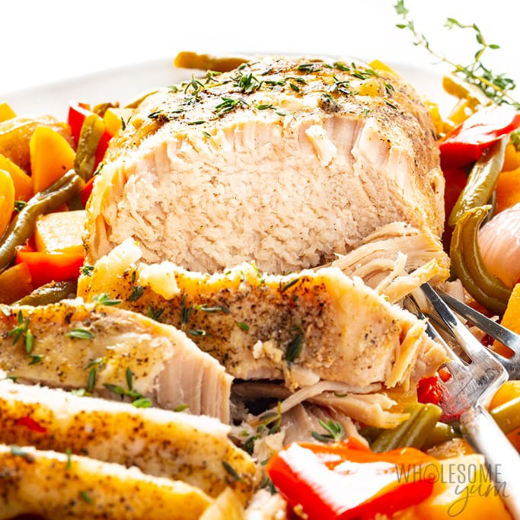 Herb roasted pork loin with vegetables.
