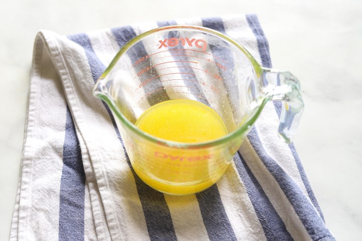 melted butter in glass measuring cup