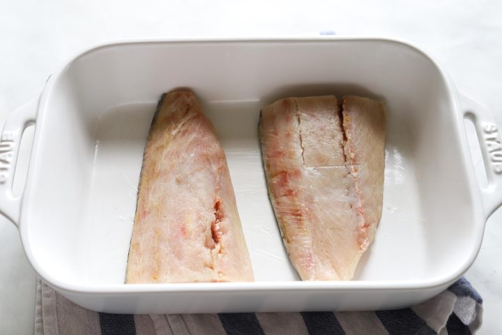 halibut fillets raw in baking dish