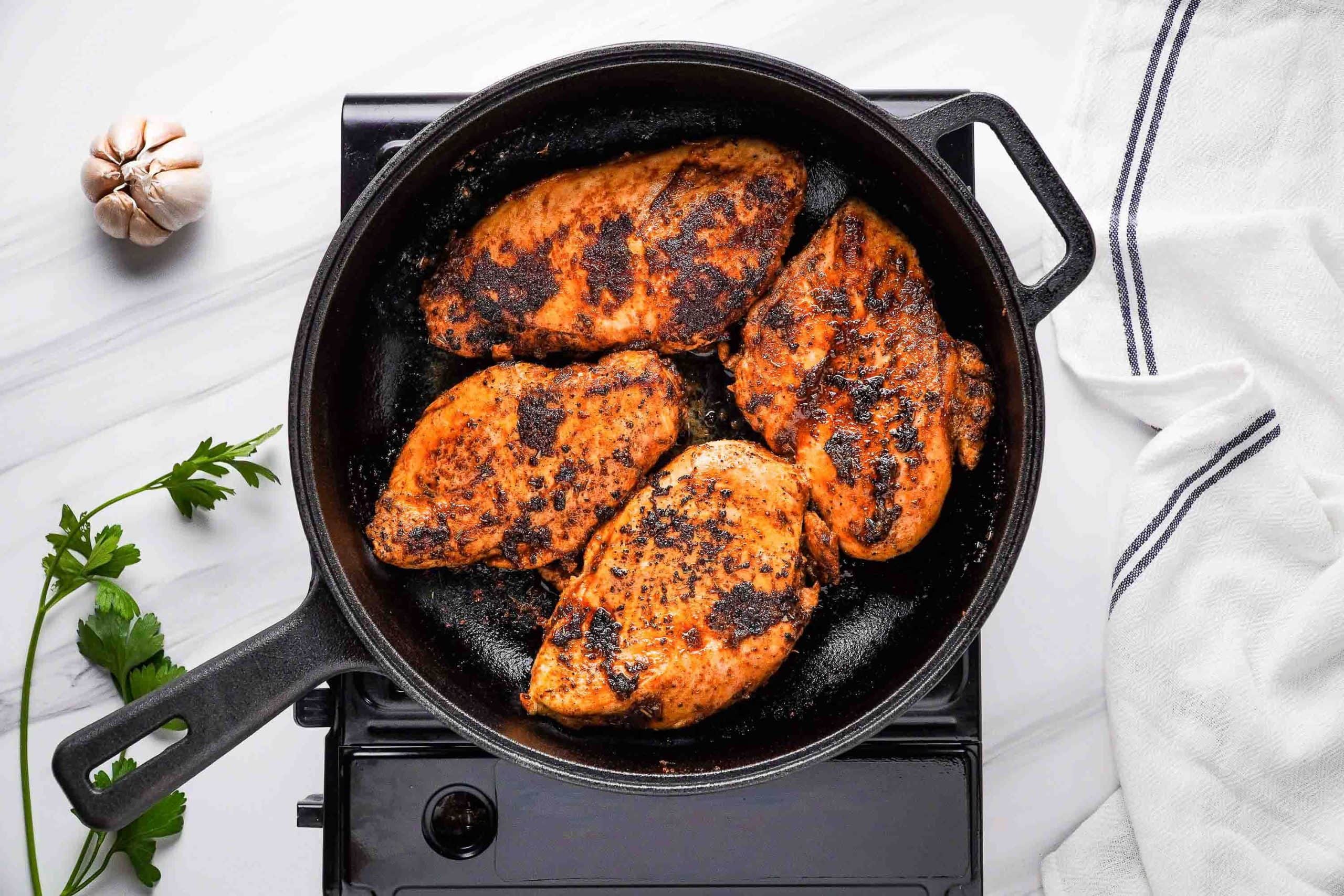 chicken breasts in skillet after cooking