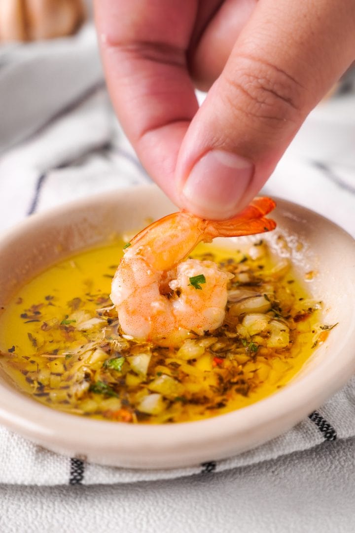 dipping shrimp in garlic butter