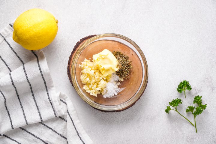 ingredients for garlic butter in small glass bowl