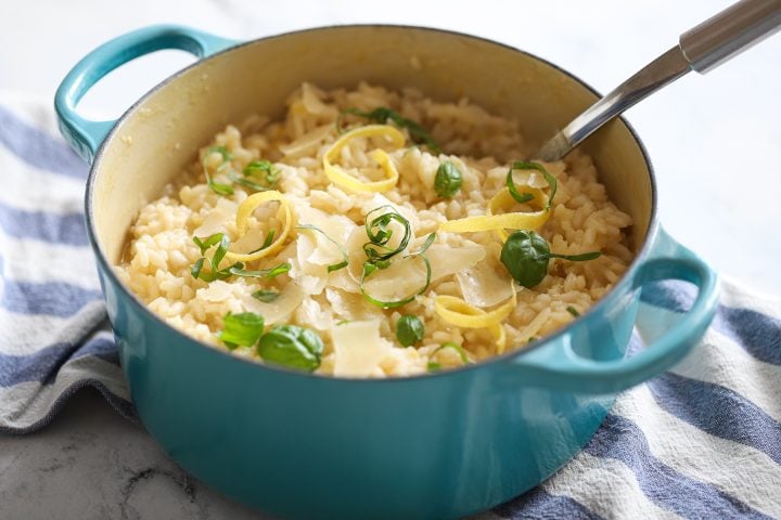 Lemon risotto with parmesan flakes and basil